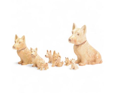 Eight Sylvac dog figures, including a graduating set of Mac and five others 