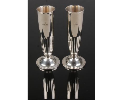 A pair of silver specimen vases by Asprey &amp; Garrard. Assayed London 2000. Stamped Asprey &amp; Garrard to bases. Height 1