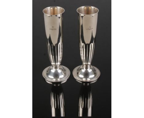 A pair of silver specimen vases by Asprey &amp; Garrard. Assayed London 2000. Stamped Asprey &amp; Garrard to bases. Height 1