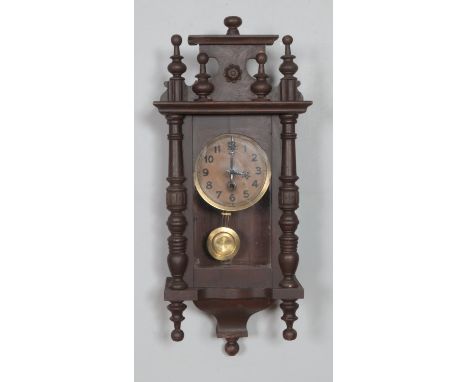 A mahogany wall clock with enamel face, turned columns and finials.Hx56cm  