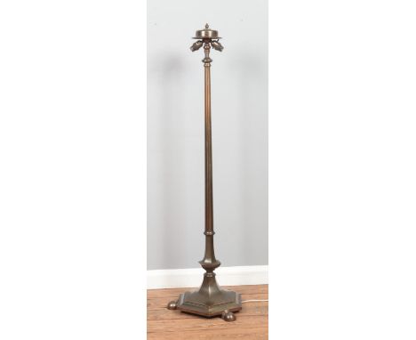A bronze 'Rise and Fall' standard lamp, on hexagonal base, raised on three ball feet. Maximum height: 190cm.  