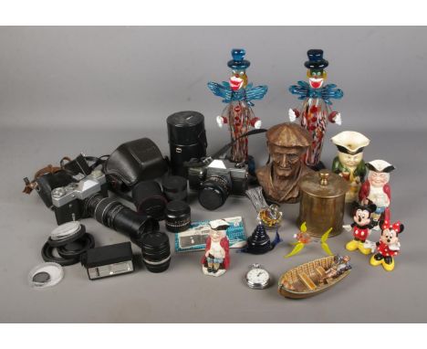 A box of assorted cameras and collectables to include Workshops Ordnance trench art, Wade Man in a Boat, Mickey and Minnie mo