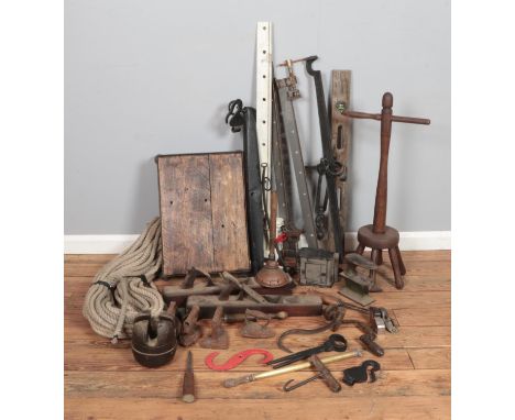 A large qauntity of metalwares mostly tools and other cast iron pieces including clamps, iron, wood planes, mini anvil, wash 
