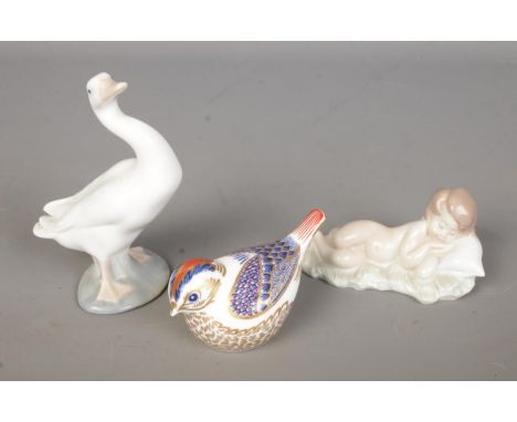 A small collection of ceramic figures to include Royal Crown Derby Goldcrest bird paperweight and two Lladro examples, duck a