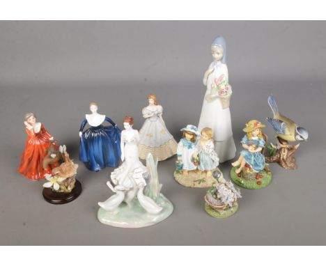 A collection of assorted figures to include Nao by Lladro duck family, Coalport ladies, Country Artists Wren on Tap, Leonardo