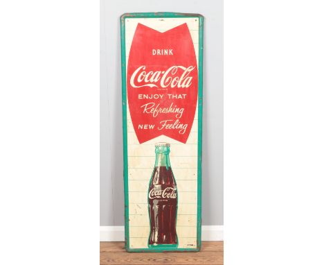 A vintage mid to late 20th Century American shop display advertising tin sign for Coca Cola "Enjoy That Refreshing New Feelin