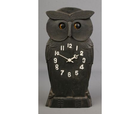 A novelty carved owl Black Forest mantle clock with rocking eyes, 24cm tall.  
