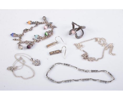 A collection of silver jewellery to include ring, mother of pearl earrings, heart pendant, etc. Total weight 33g.  