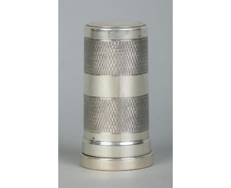 A George V silver cylindrical shaving brush case with engine turned decoration. Housing a Kelson shaving brush. Height 8.5cm.