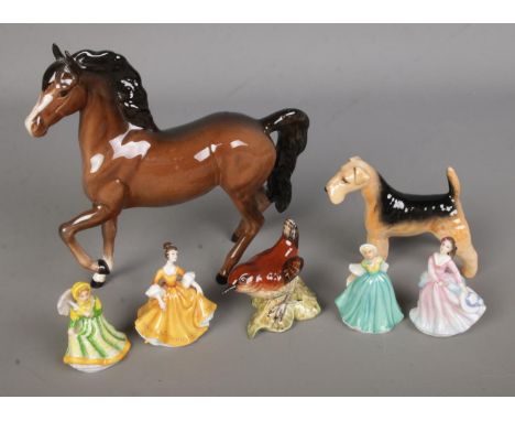 A collection of ceramic figures to include Beswick prancing horse, Airedale Terrier and Wren along with four miniature Royal 