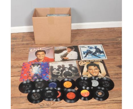 A box of assorted vinyl LP records and singles of mainly pop and rock to include Michael Jackson Thriller, Elvis Presley, Que