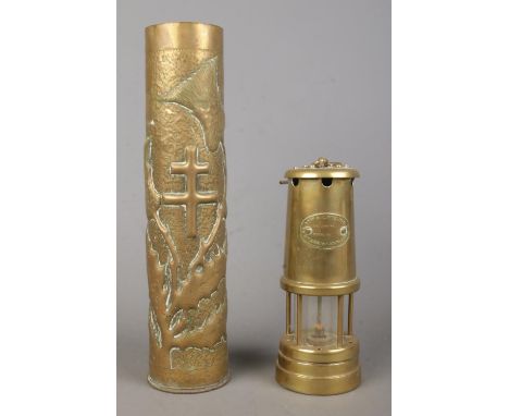 A Hockley Lamp and Limelight Company miners lamp together with a detailed trench art shell case vase, depicting thistles.  