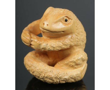 A hand carved hardwood netsuke of frog.  