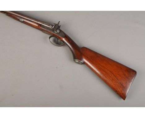 A 19th Century George and John Deane side by side percussion shotgun. Muzzle loading. With thirty inch barrels and the top ri
