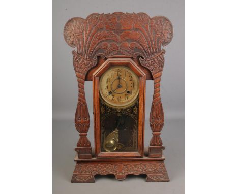 Late 19th century American gingerbread mantle clock, the dial marked ' made in the New Haven Clock Co. New Haven, Conn. U.S.A