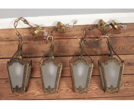 Four hanging lantern lights with frosted glass panels.  