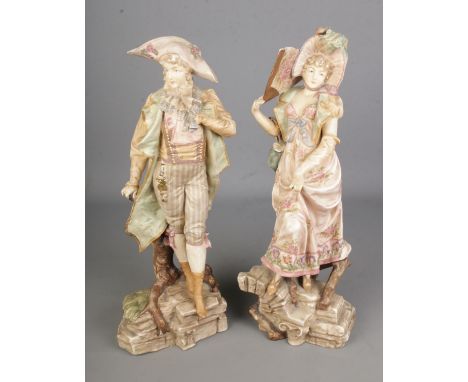 A pair or ceramic figures in the style of Royal Dux. Hx46cm approx.  Signs of repair to the male figures jacket.