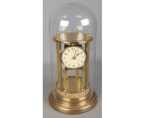 An ornate Badische Uhrenfabrik gilt mantel clock under glass dome. (45cm)  