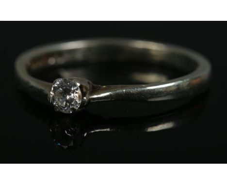 A 9ct white gold moissanite solitaire ring. Size O, 2g.  