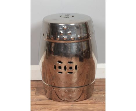 A ceramic barrel stool with silver finish. Height: 47cm  
