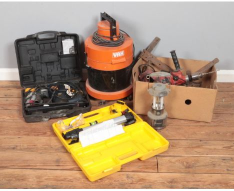 A collection of power tools including Mac Hammer drill, Laser tool, Vas hoover and other tools  