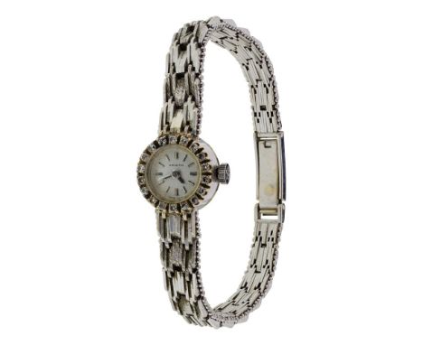 Zenith 18k White Gold Case and Band Wristwatch  Having a diamond bezel with integrated band (marked '18k' / '750' on back of 