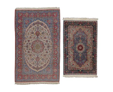 Persian Hand Knotted Wool Rugs  (2) items including an abstract floral having a center medallion in hues of blue, wine, tan a