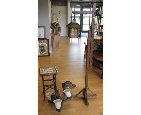 A freestanding electirc lamp / latern, together with matching ceiling lights and a titled topped bamboo occisonal table (4)