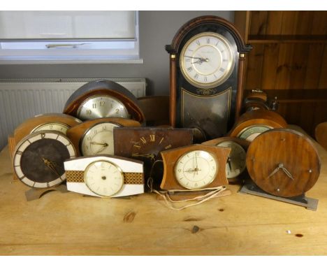 A collection of mantle clocks, including a Wuba moon phase and striking small bracket clock 