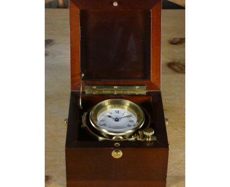 FCC Precisio, a quartz brass marine chronometer type time piece, with gimbals, 2 1/2" dial, mahogany case 