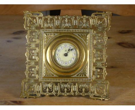 A 19th century cast and pierced brass easel clock, with German movement 