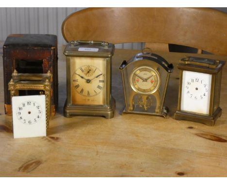 An Ansonia alarm carriage clock, 14 cm, a Schatz 8 day clock, a brass carriage clock, and a partial brass carriage clock fram