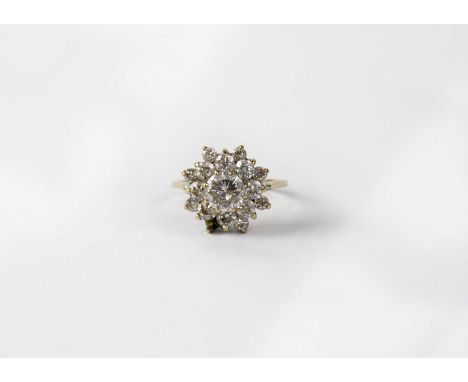 A 9ct yellow gold dress ring floral set with white stones (lacking one stone), size K, approx. 2.5g.