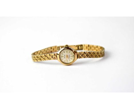 ACCURIST; a ladies' 9ct gold vintage wristwatch, the circular dial set with Arabic and baton numerals, 21 jewel crown wound m