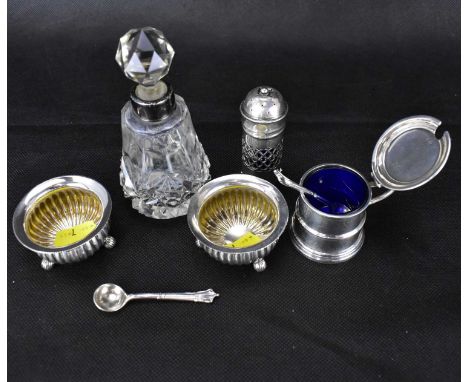 Six items of hallmarked silver comprising a mustard pot in the form of a tankard with blue glass liner, height 4cm, a peppere