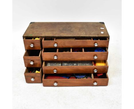MECCANO; a seven-drawer chest containing a large quantity of vintage metal Meccano pieces, various colours, wheels, screwdriv