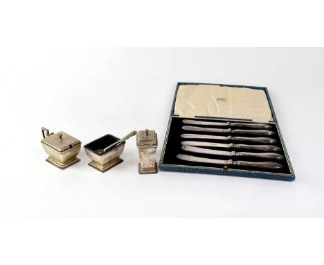 A George VI Art Deco shaped hallmarked silver three-piece cruet set comprising a salt, mustard with blue glass liners, and pe