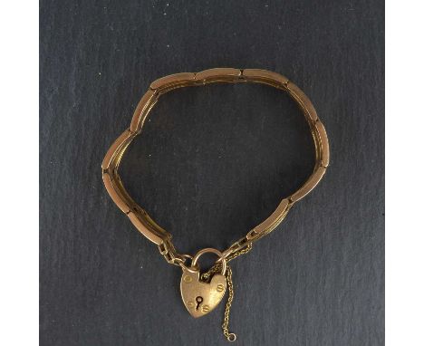 A 15ct rose gold gate bracelet with heart-shaped padlock clasp, length 16cm, approx. 20.2g.
