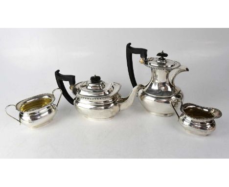 A George V hallmarked silver four-piece tea service, comprising teapot, coffee pot, cream jug and twin-handled sugar bowl, Vi