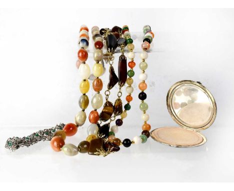 A quantity of costume jewellery to include hardstone necklaces, a white metal link bracelet with jade-coloured stones and a w