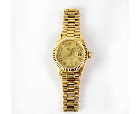 ROLEX; an 18ct gold ladies' Oyster Perpetual Datejust chronometer wristwatch, the champagne dial set with diamond numerals an