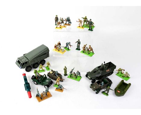 A collection of military figures and vehicles to include multiple model soldiers, a Britains Ltd L.W.B. Land Rover, a Britain