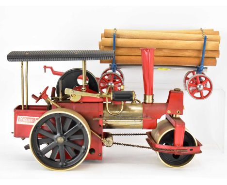 WILESCO, GERMANY; a red steam model traction engine/steamroller with log wagon, unboxed (2).Condition Report: This item has c