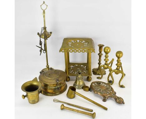 Various items of 19th century and later brassware to include a trivet, mortar and pestle, candlestick, fire dogs, lamp/incens