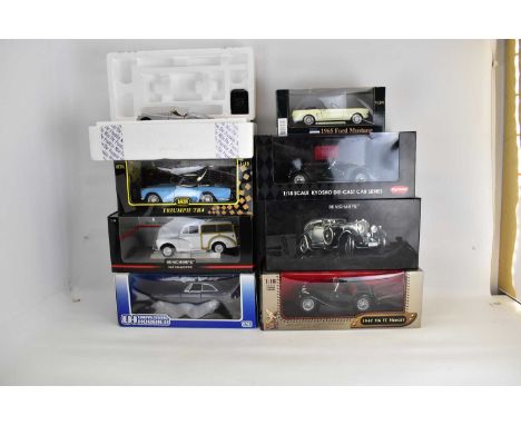 Eight boxed diecast scale model vehicles comprising Minichamps, Ford Mustang, Leather Series, Jadi Triumph TR4, Kyosho Morgan