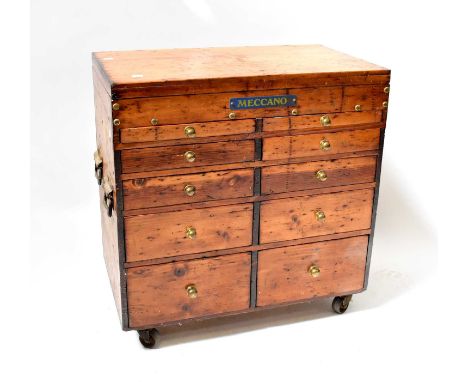 MECCANO; a large pine ten-drawer Meccano chest on wheels, containing a large quantity of vintage and contemporary pieces, var
