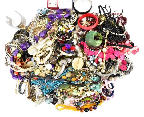 A large quantity of mixed modern and vintage costume jewellery to include necklaces, bangles, bracelets, rings, etc.