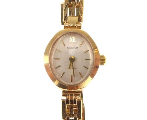 ACCURIST; a ladies' vintage 9ct gold wristwatch, the oval silvered dial set with raised baton numerals, crown wind movement, 