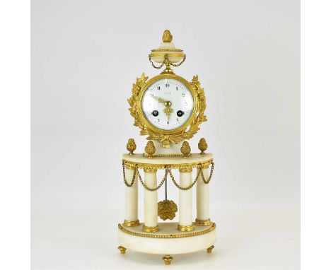 A late 19th century French gilt metal and alabaster chiming mantel clock in the Classical style, with an A.D. Mougin movement