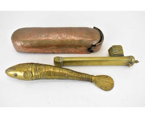 A 19th century Middle Eastern brass reticulated fish with ruby set eyes, length 30cm (missing one fin), a 19th century Middle